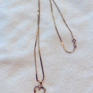 Beautiful heart necklace, white gold with diamond inlays.